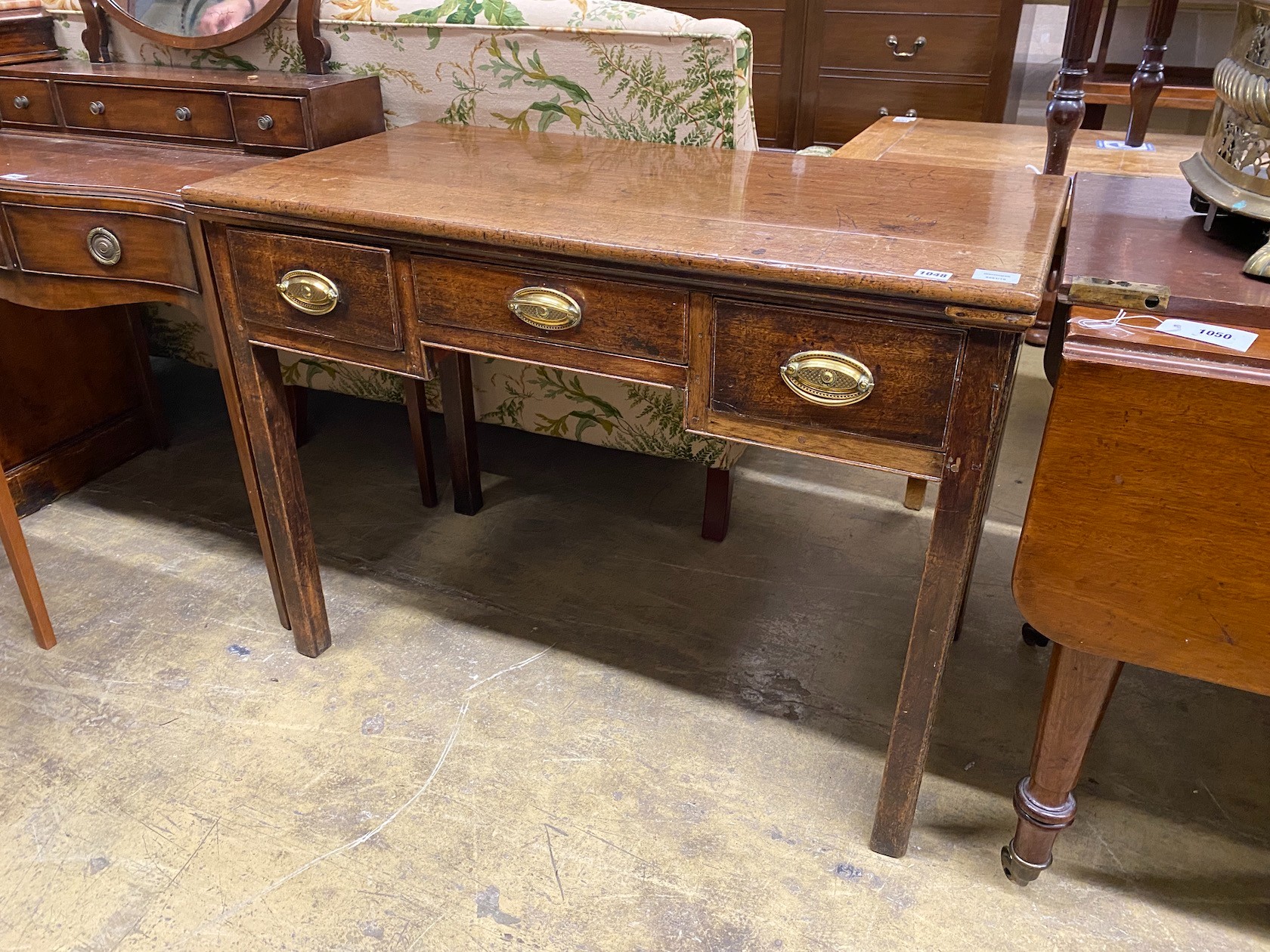 A George III and later mahogany kneehole table, length 183cm, width 53cm, height 75cm